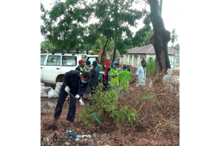 NGO Representatives and Community Member Take part in a Clean-Up